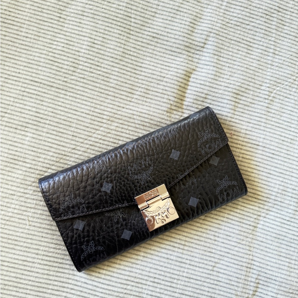 MCM Black Clutch with Gold-Tone Accents - Picture 2 of 3